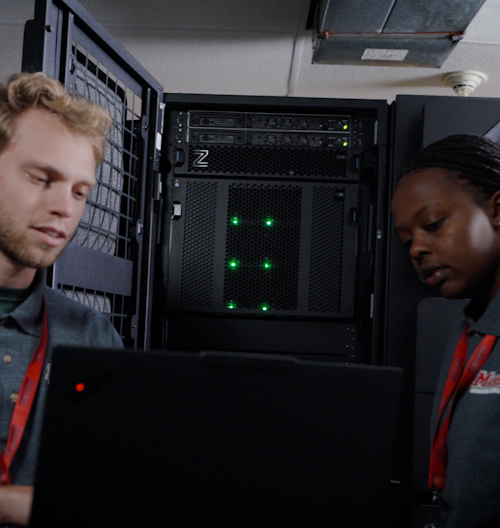 Zooming in on the IBM Z mainframe with students plugging in cables